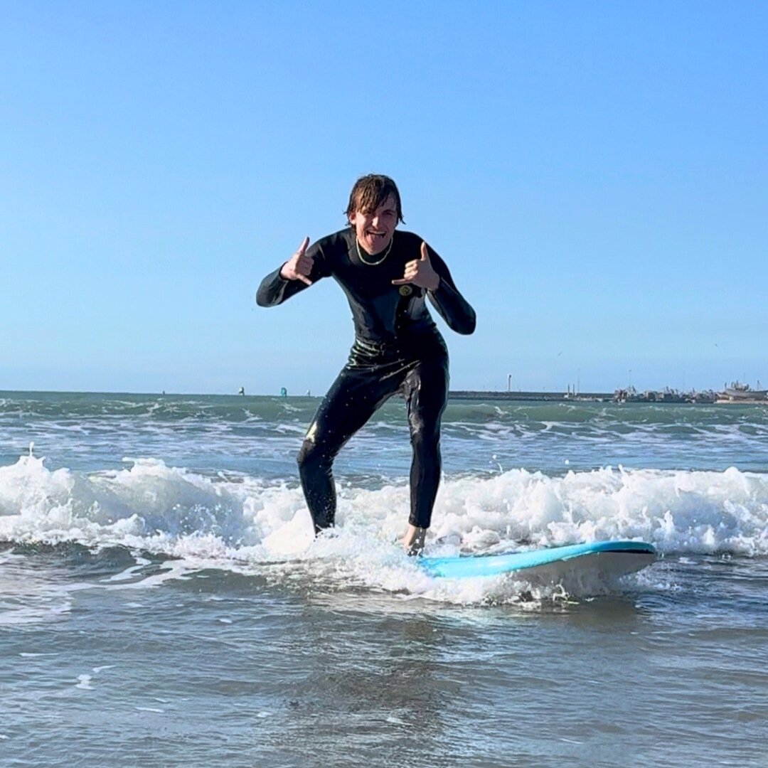 Male traveller riding a wave in a private surf lesson in Essaouira