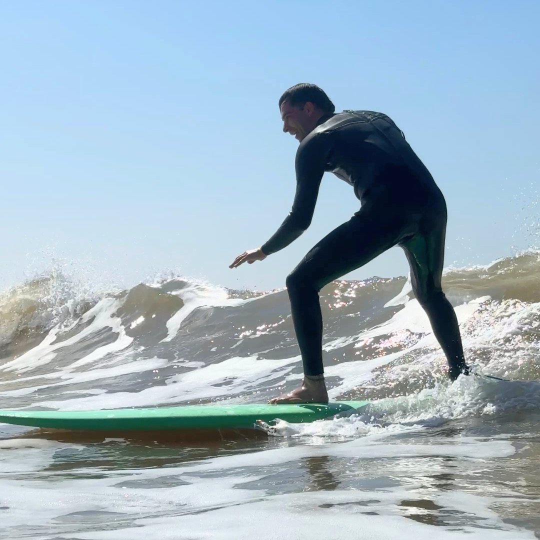 Male traveller riding a wave in a private surf lesson in Essaouira